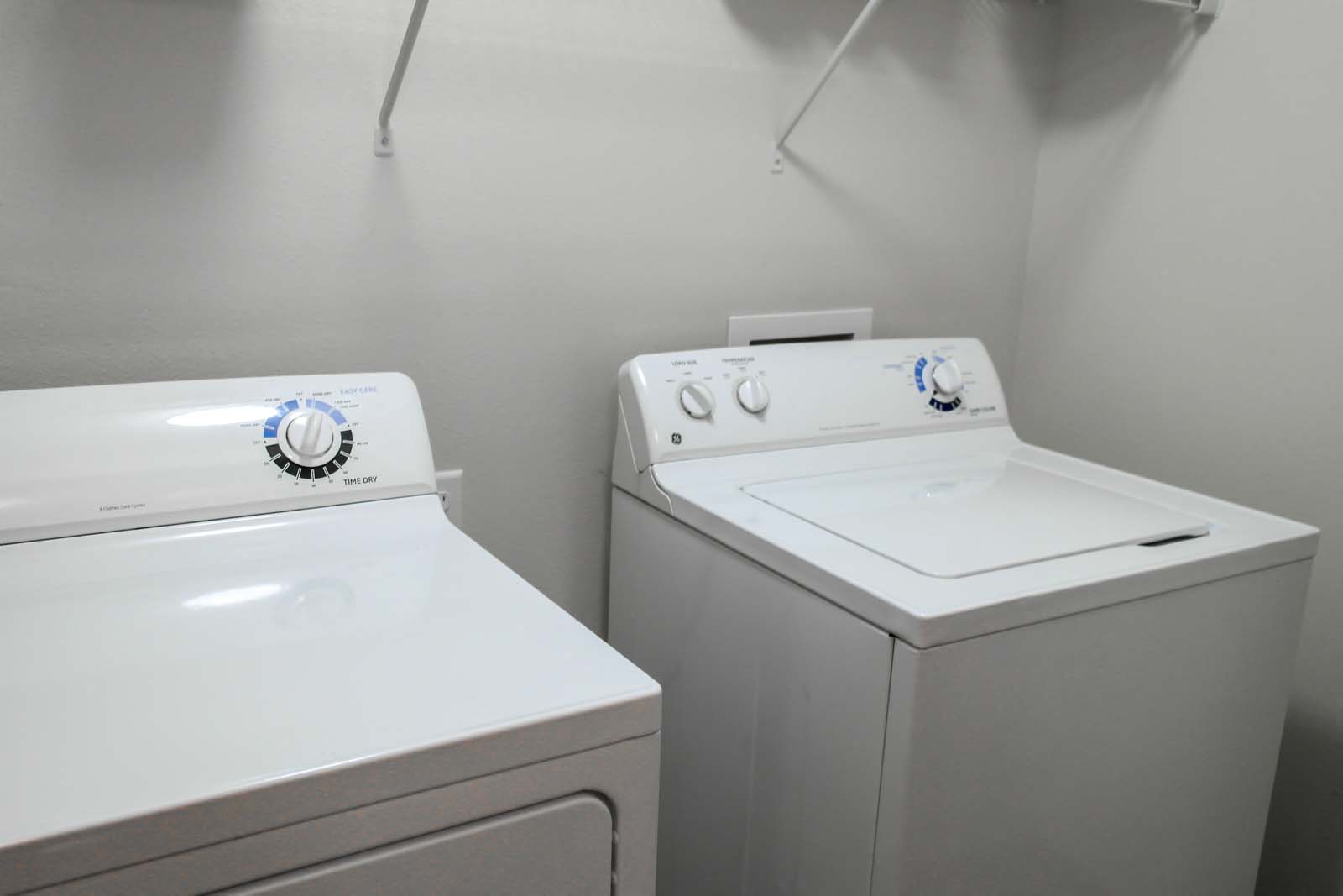In-unit washer and dryer at Amber Ridge Apartments in Fargo ND with shelves.