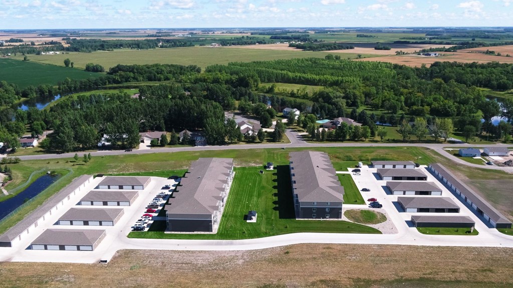 an aerial view of an industrial area with buildings and a parking lot