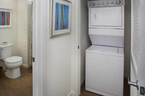 Washer/dryer closet adjacent to bathroom