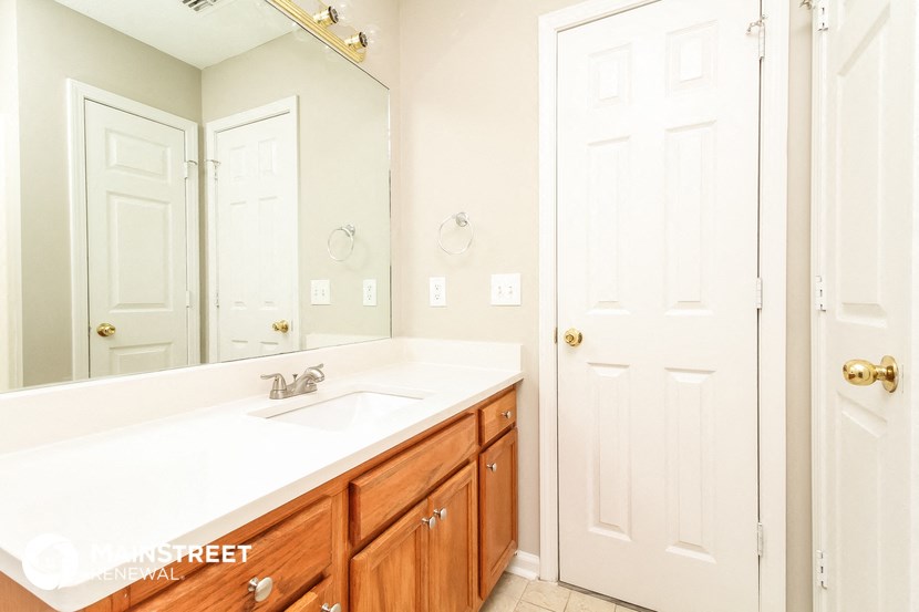 a bathroom with a sink and a mirror