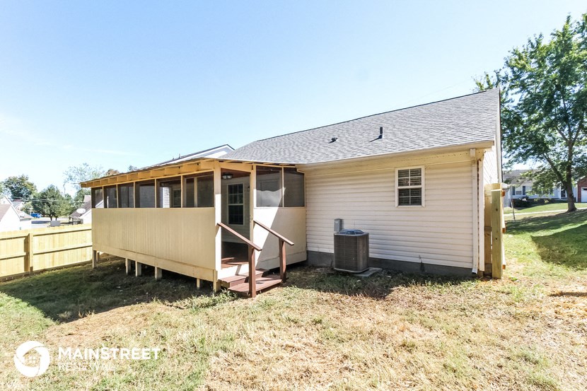 a small house with a porch and a backdoor