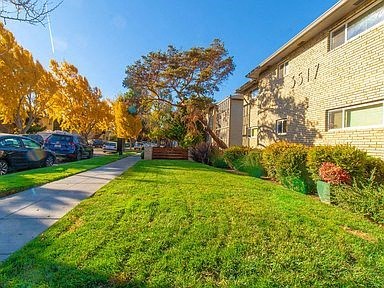 a green lawn in front of a house