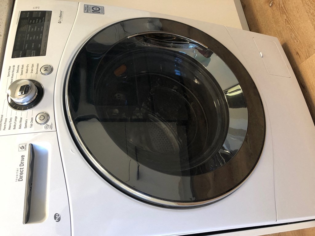 a white washer and dryer sitting on top of a counter