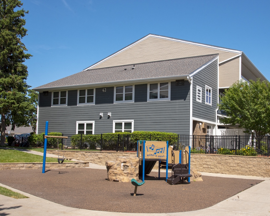 a playground in front of a house