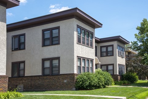 a view of the exterior of two buildings on a sunny day
