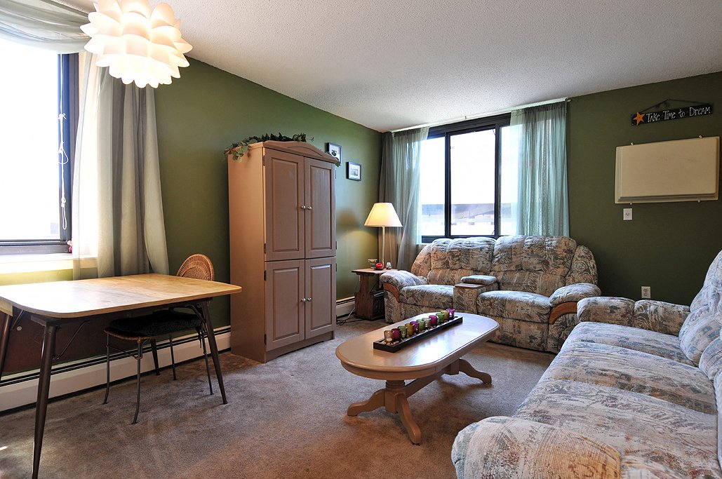 a living room with couches and a table