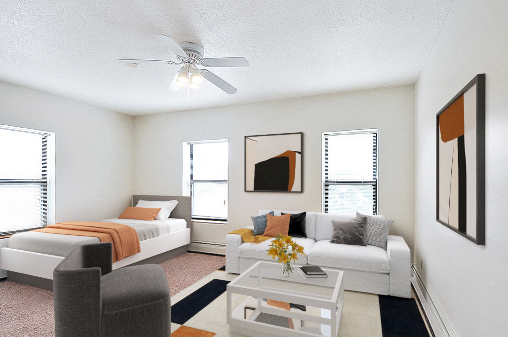 our apartments offer a living room with two beds and a ceiling fan
