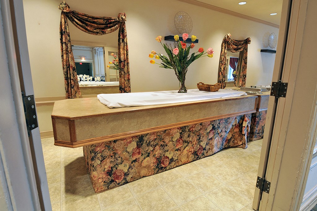 a bath room with a sink and a mirror