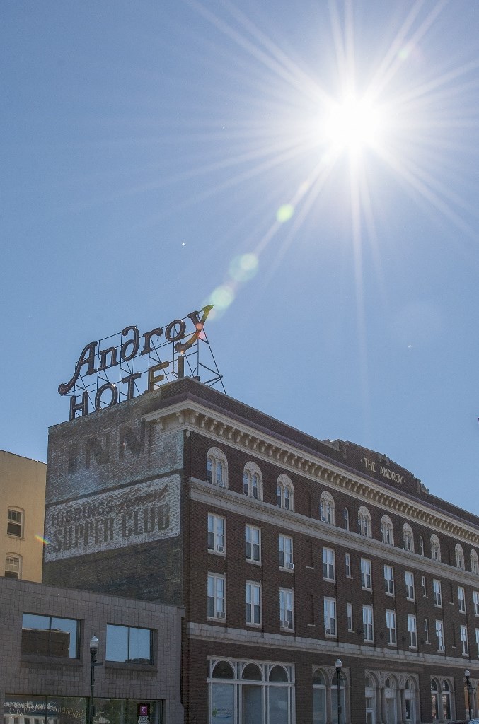 A photo of the side of The Androy Apartments in Hibbing, MN under a clear, sunny sky