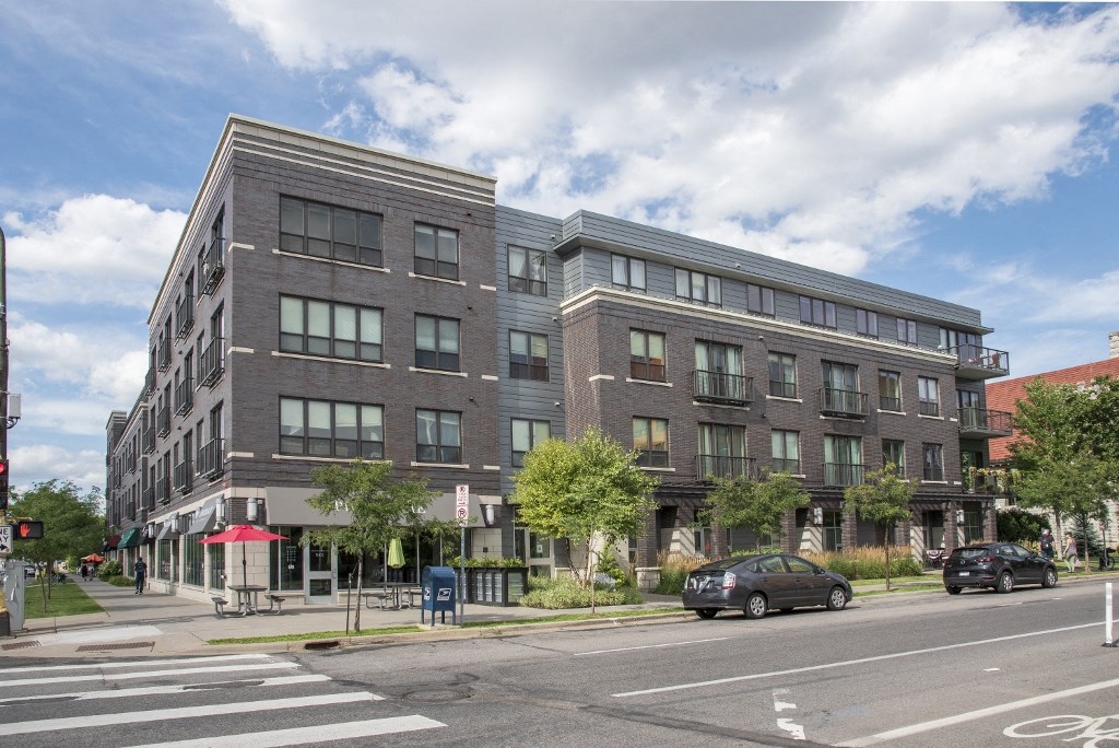 a brick building on the corner of a city street