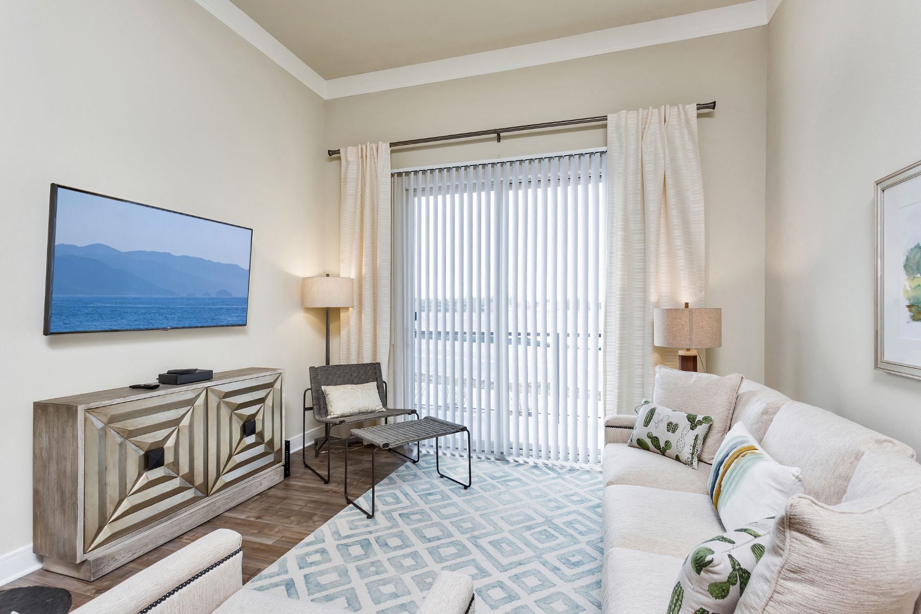 Westwood Green Apartments Living Room with faux wood floors and sliding doors to balcony