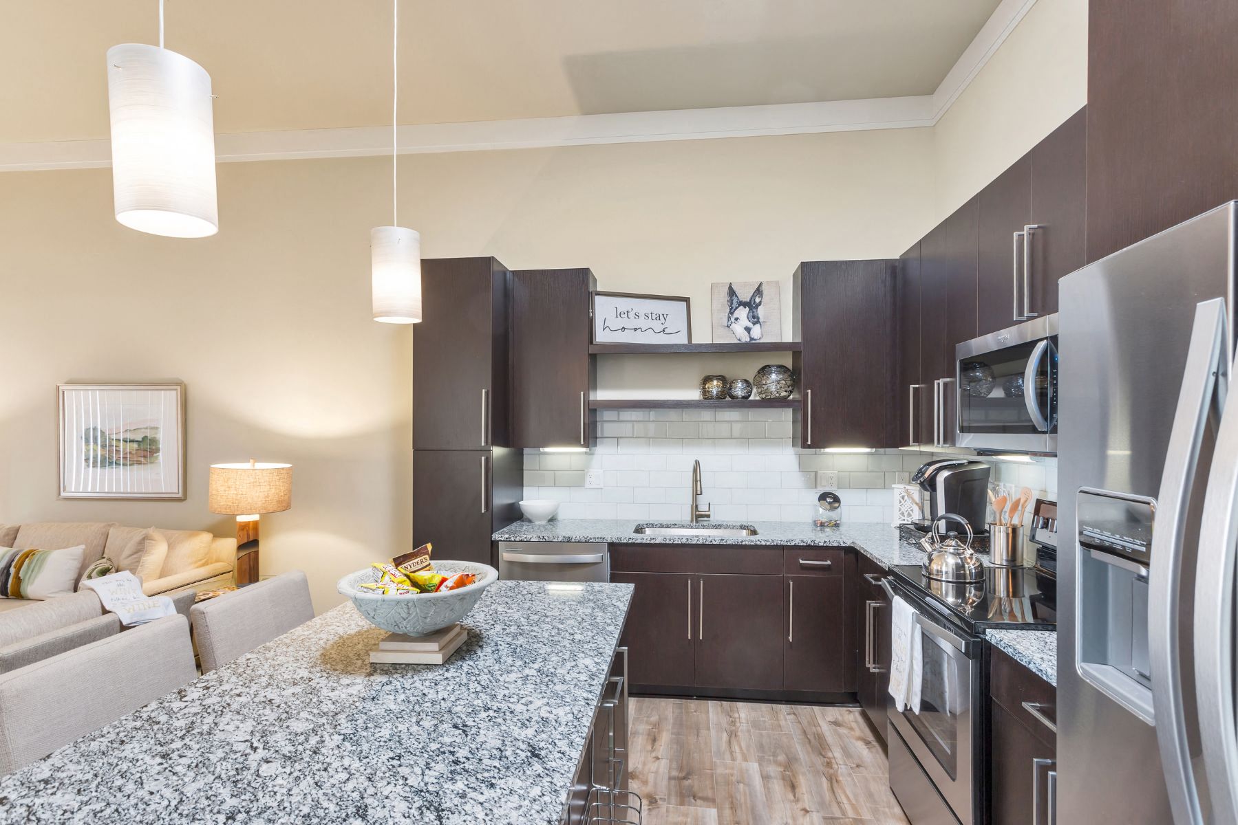 Westwood Green Apartments Kitchen with large island, stainless appliances, and quartz countertops