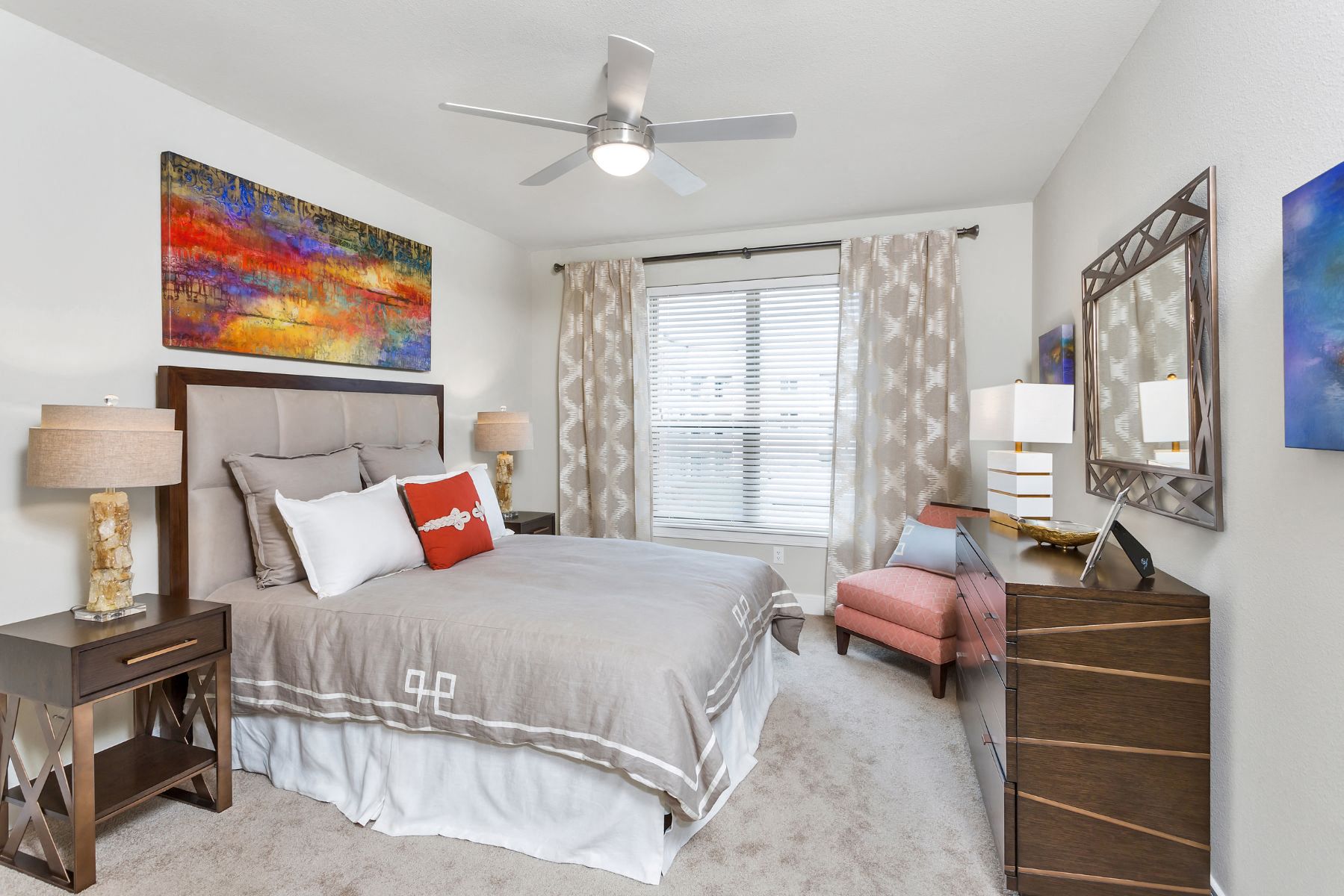 Westwood Green Apartments Bedroom with wall to wall carpet, ceiling fan, and large window