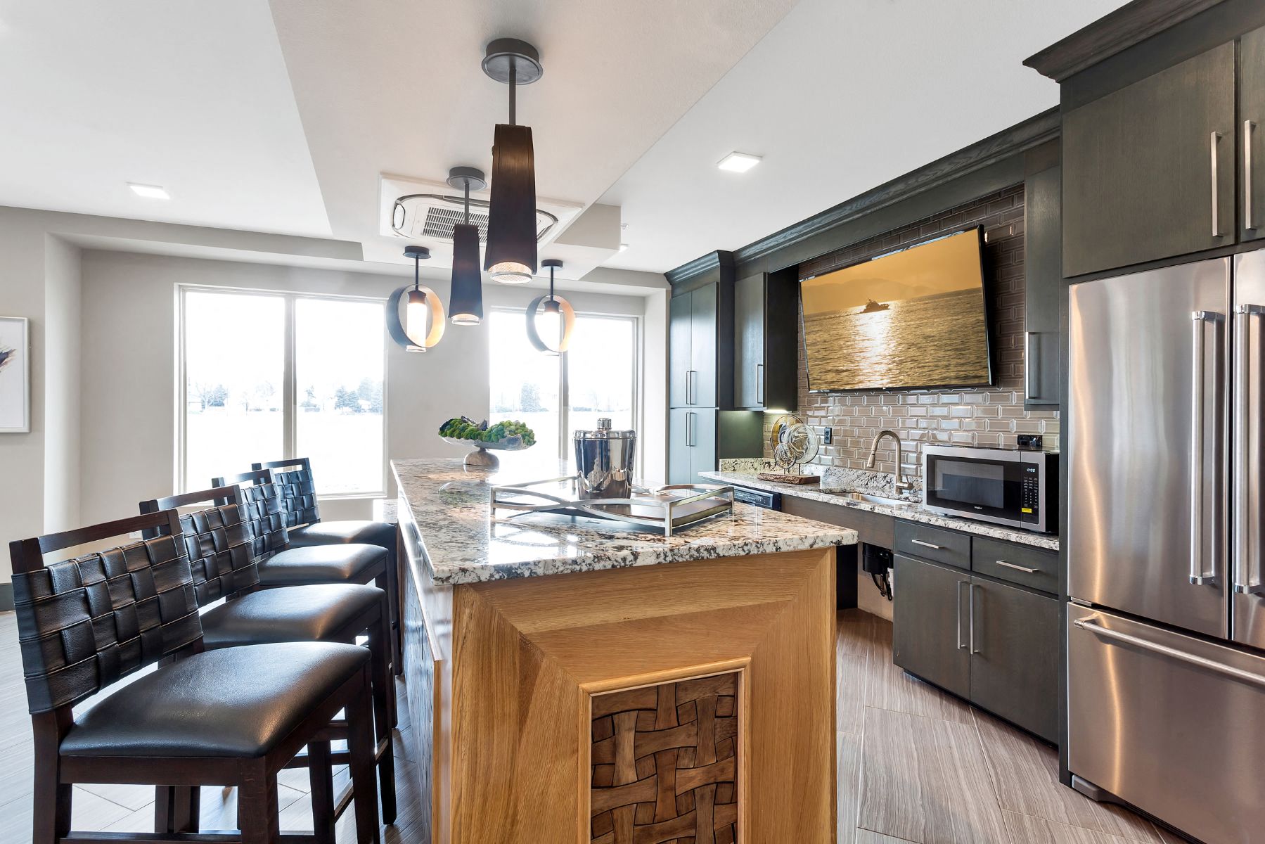 Westwood Green Apartments Clubhouse full kitchen with stainless appliances and bar height countertop