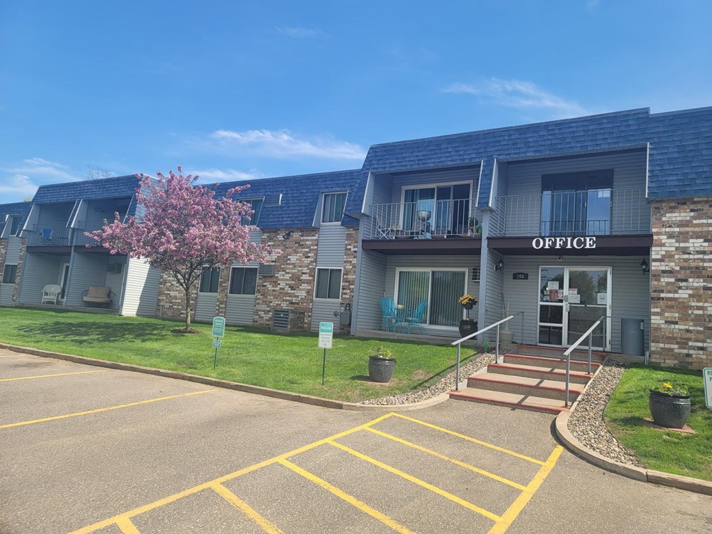 the exterior of an office building with a blue roof