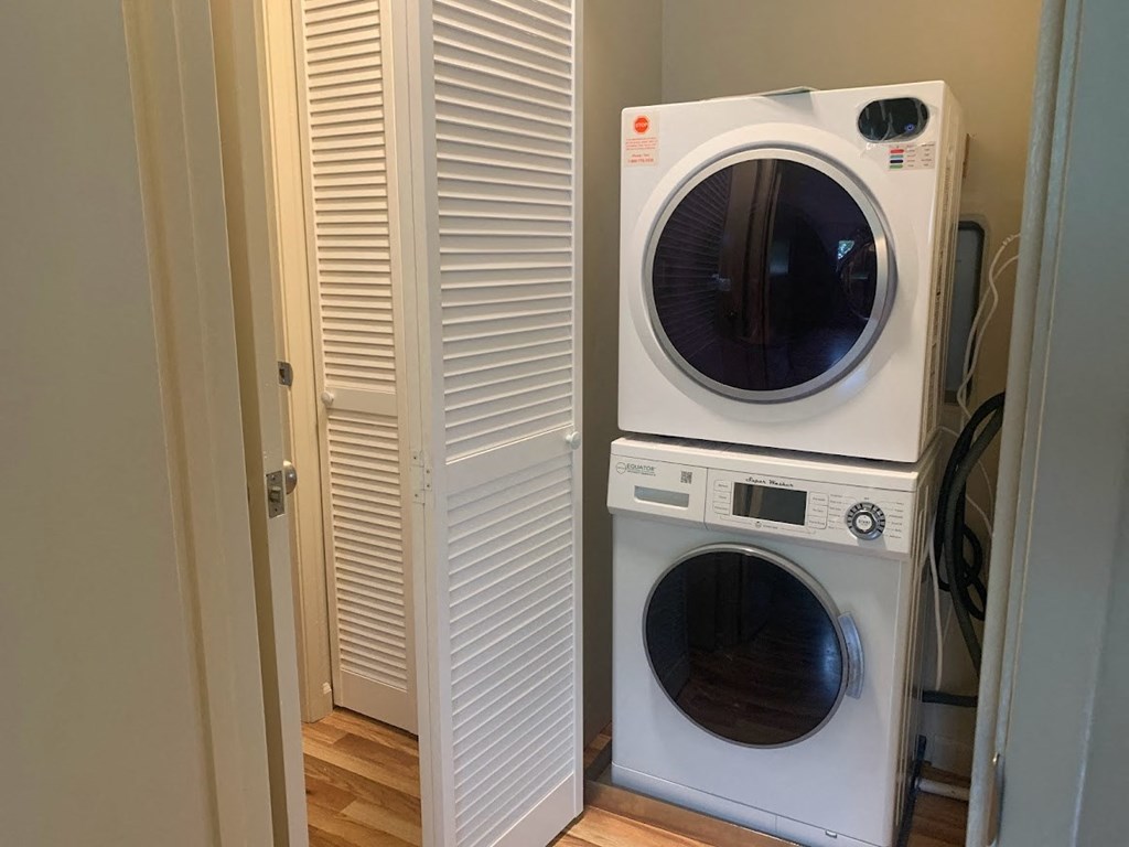 a washing machine and a dryer in a small closet