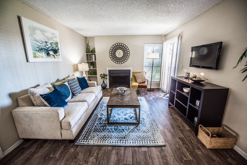 our apartments offer a living room with a couch and a tv