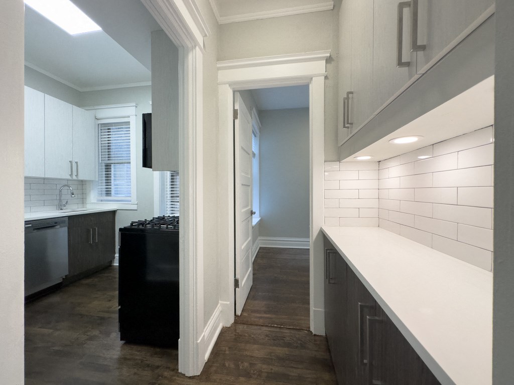 a view of the kitchen from the living room in a new home