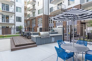 Outdoor Grill With Intimate Seating Area at Spoke Apartments, Atlanta, GA, 30307 - Photo Gallery 2