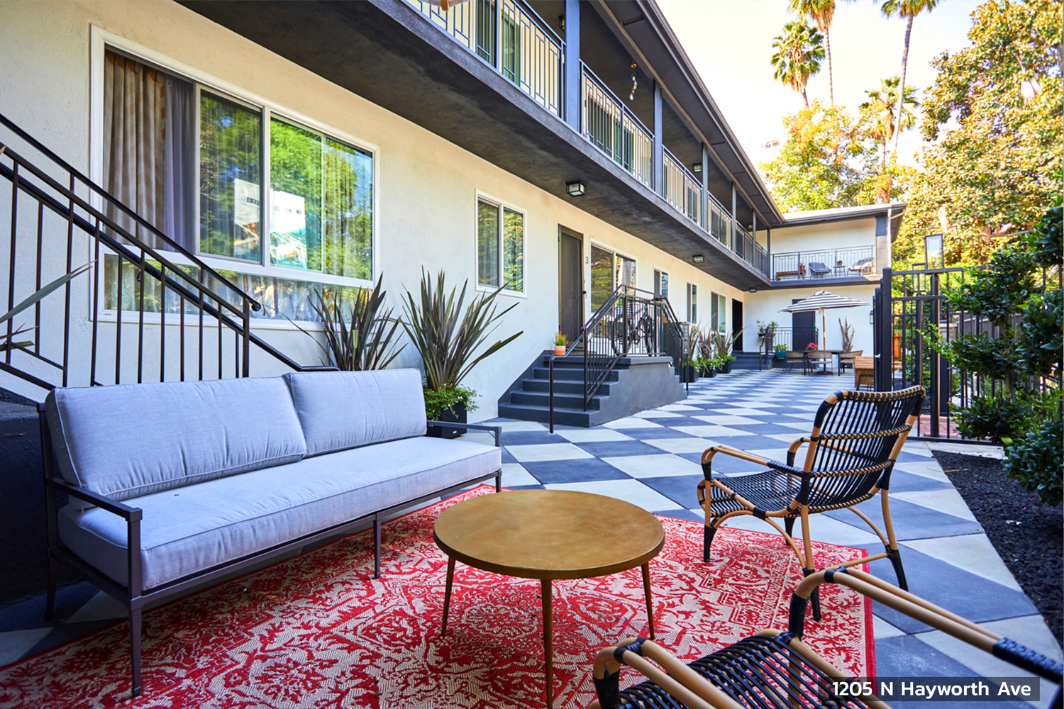 Outdoor lounge area outside of units with seating