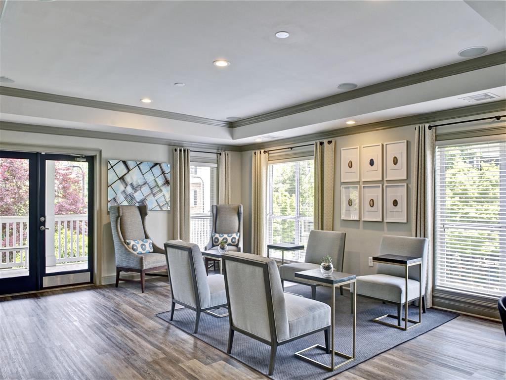 a living room with a table and chairs
