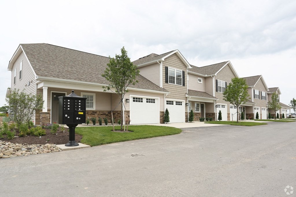 the front of a house with a drive way and a driveway