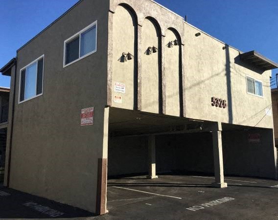 a large building with a parking lot
