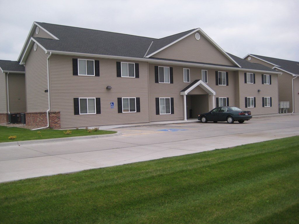 a large building with a car parked in front of it