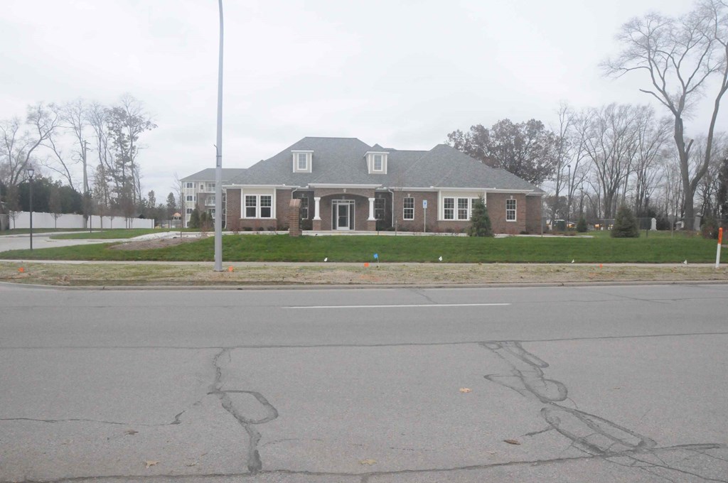 a large house on the corner of a street