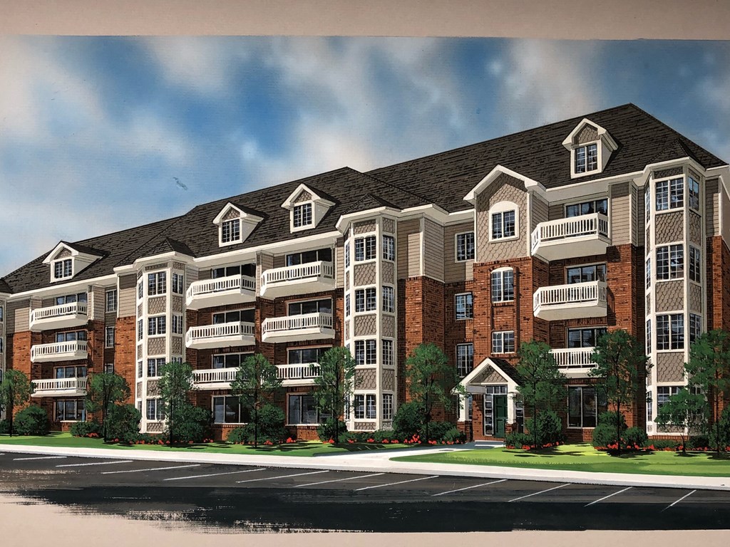 a rendering of an apartment building on a city street