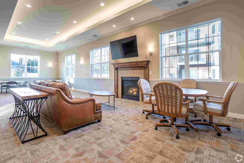 a large living room with furniture and a fireplace