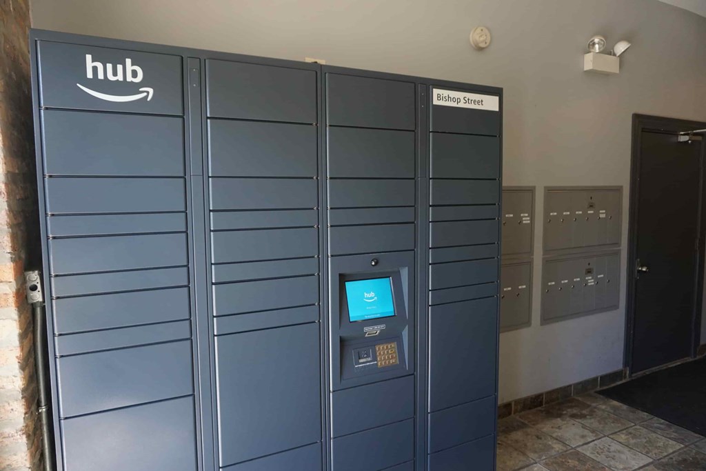 a set of blue lockers with a computer in the door