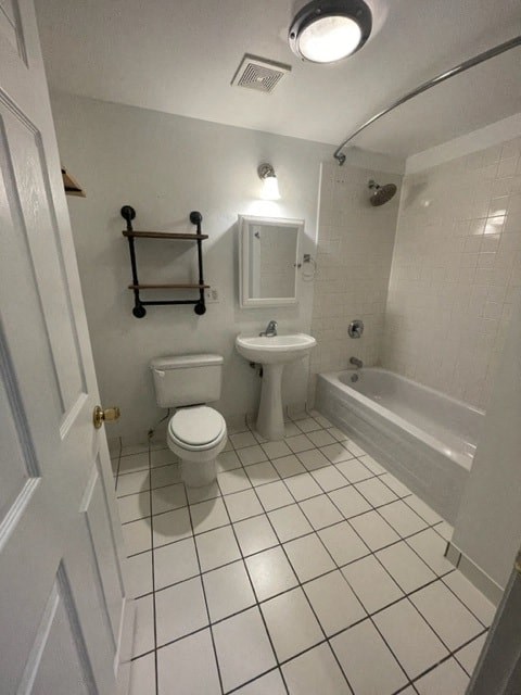 a bathroom with a toilet sink and a bath tub