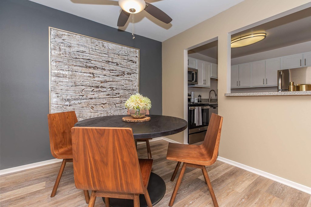 a dining room with a table and chairs