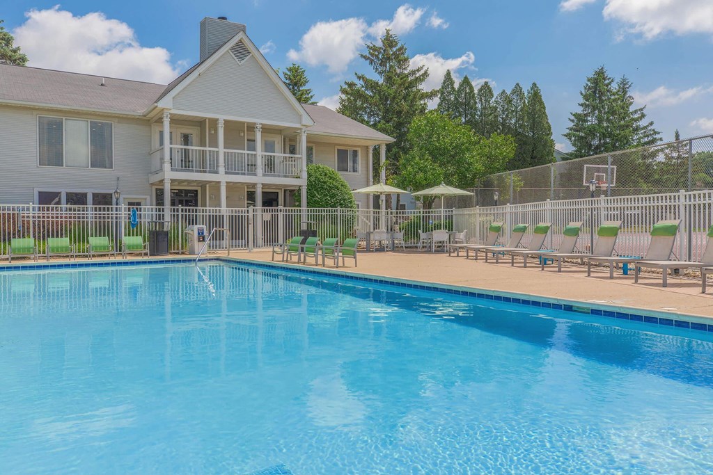 the swimming pool at the apartments resort style pool