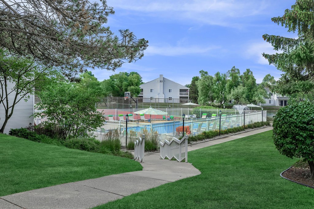 the preserve at ballantyne commons community swimming pool with trees and grass
