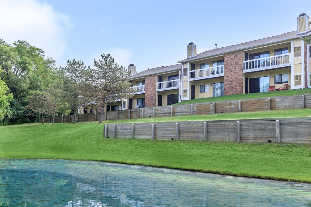 the view of an apartment building from across the water