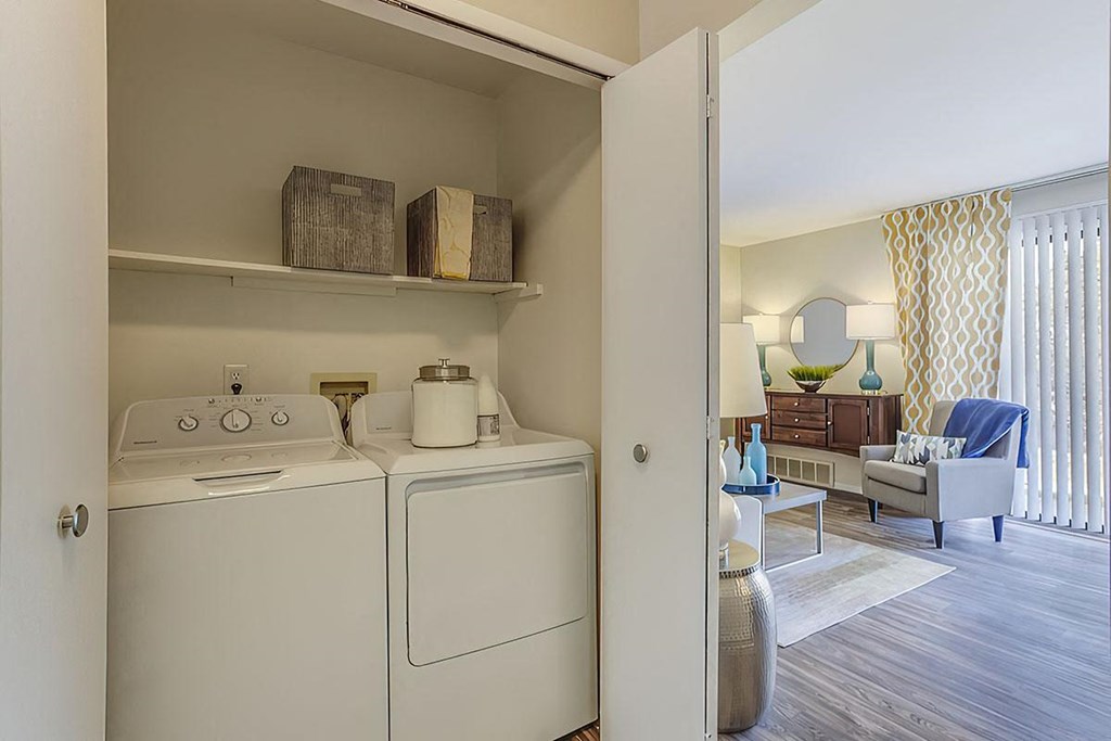a washer and dryer in a room with a living room