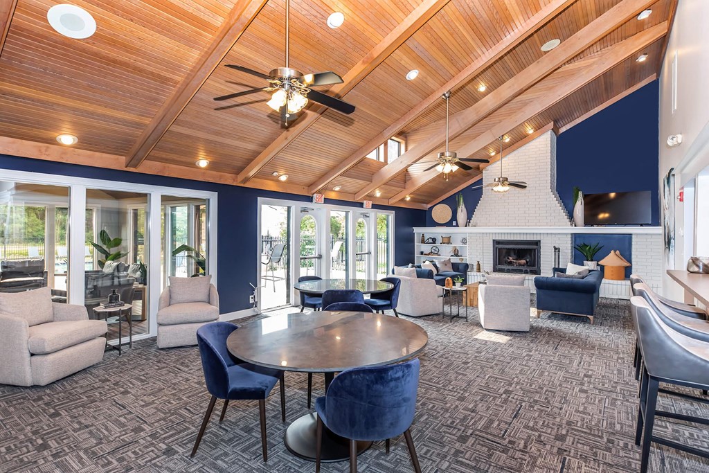 a large living room with furniture and a fireplace