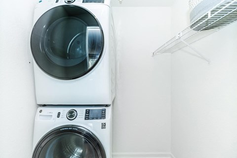 a washing machine and dryer in a laundry room