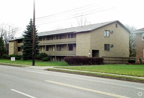 an apartment building on the side of a street