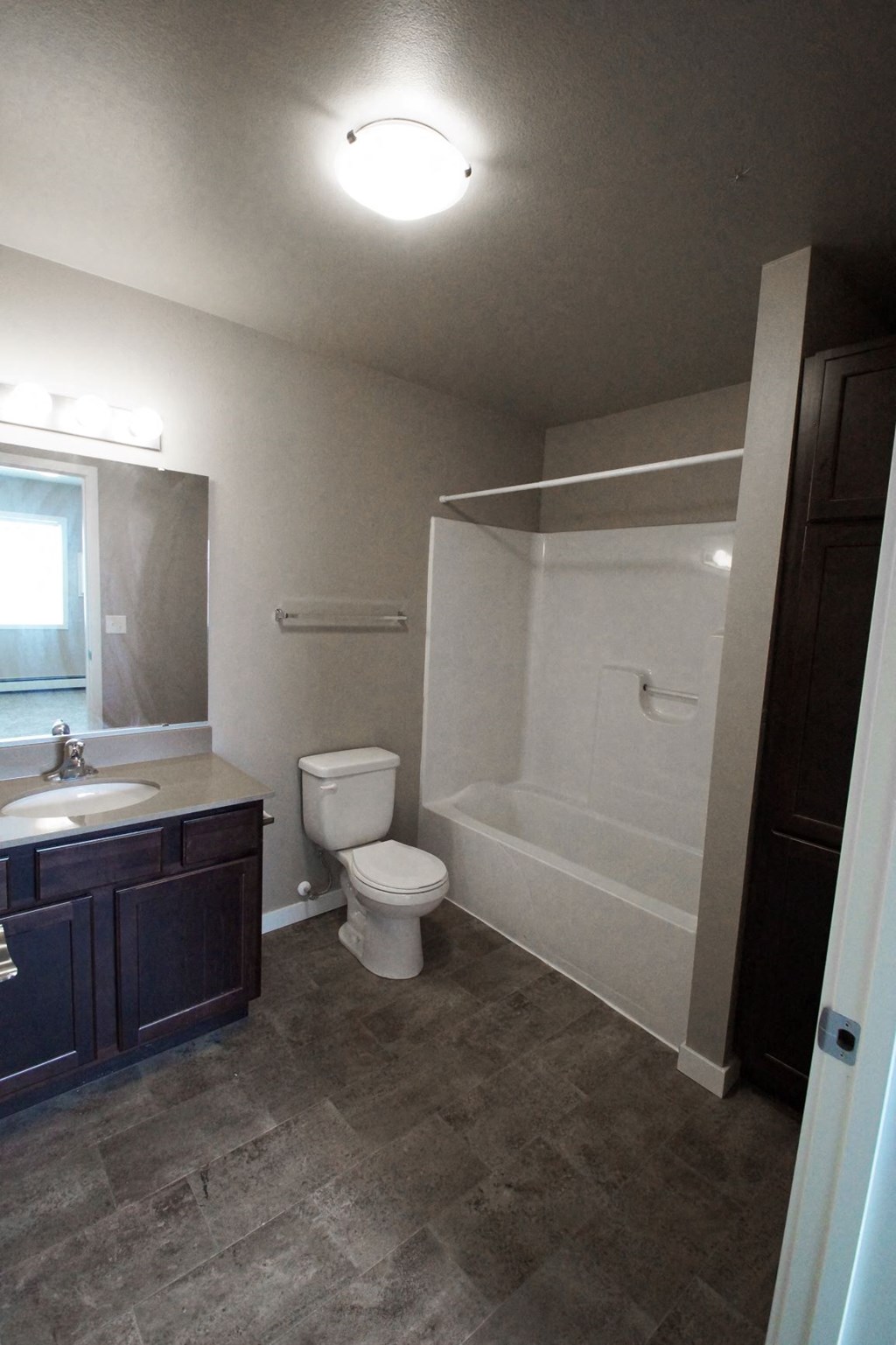 a bathroom with a toilet sink and a shower