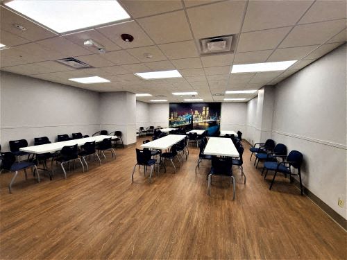 a large room with tables and chairs in it