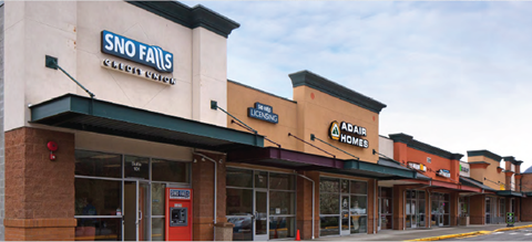 A Sno Falls store is located in a strip mall.