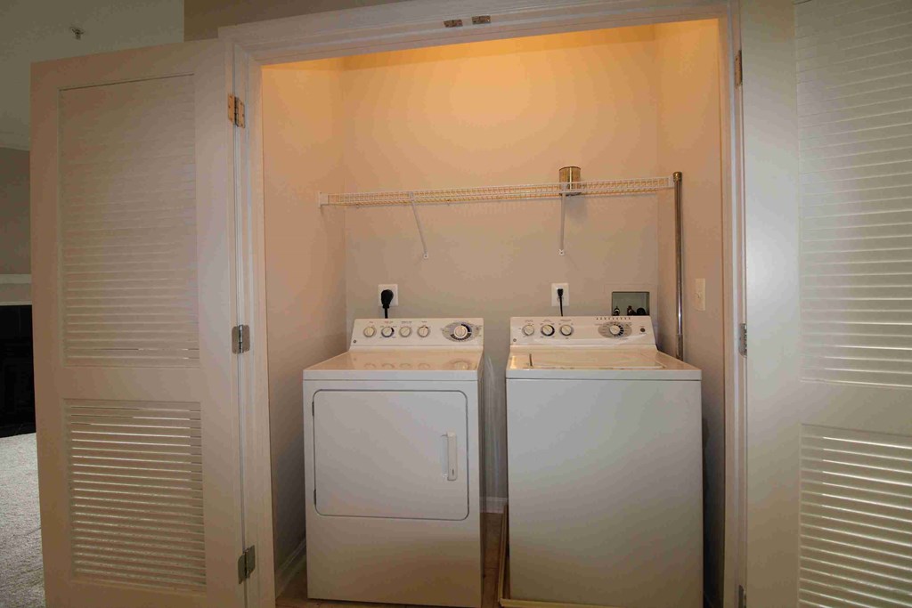 a laundry room with two washes and a dryer in it