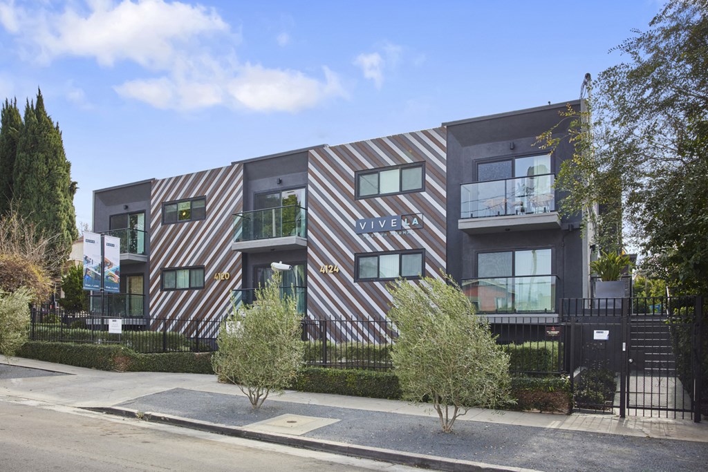 Exterior with shrubbery and trees