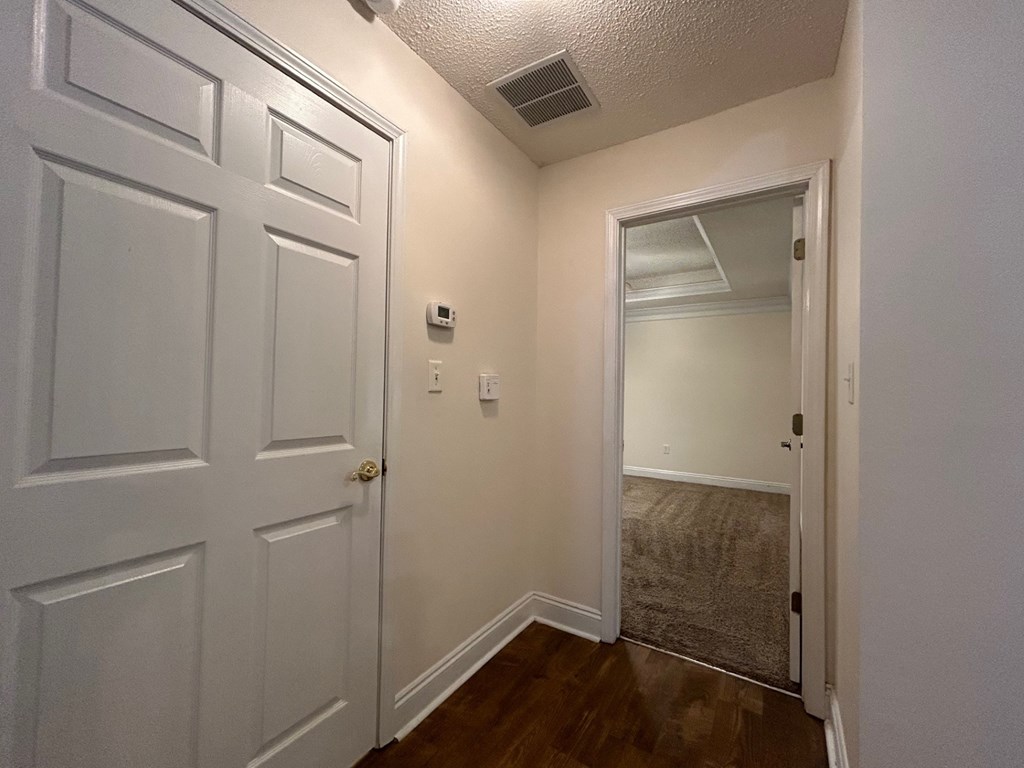 A white door is on the left and a white door is on the right.