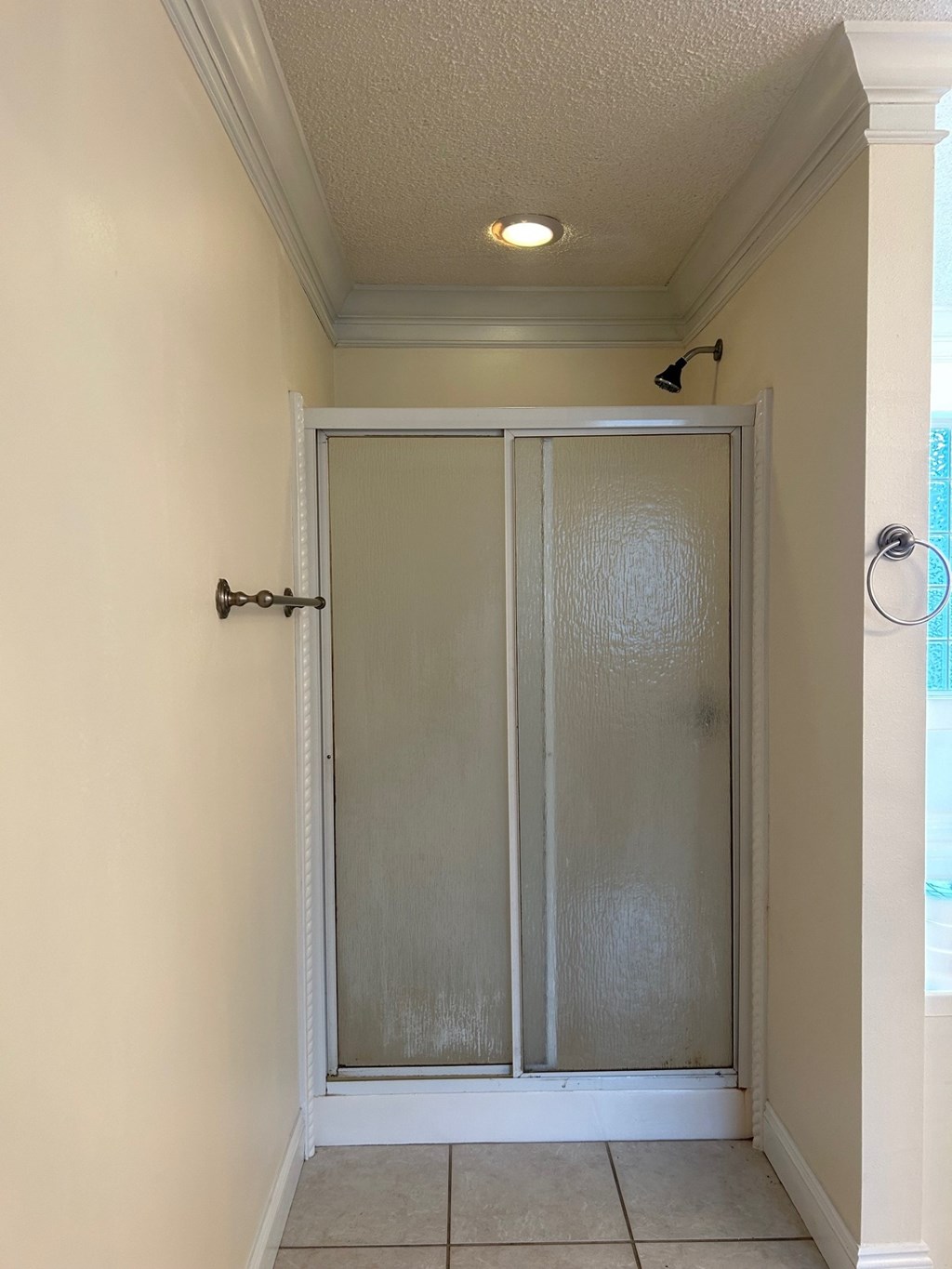 A white door with a glass panel and a black handle.