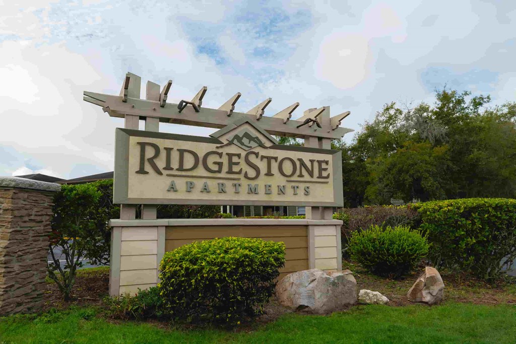 the sign for ridgestone apartments at the entrance to the property