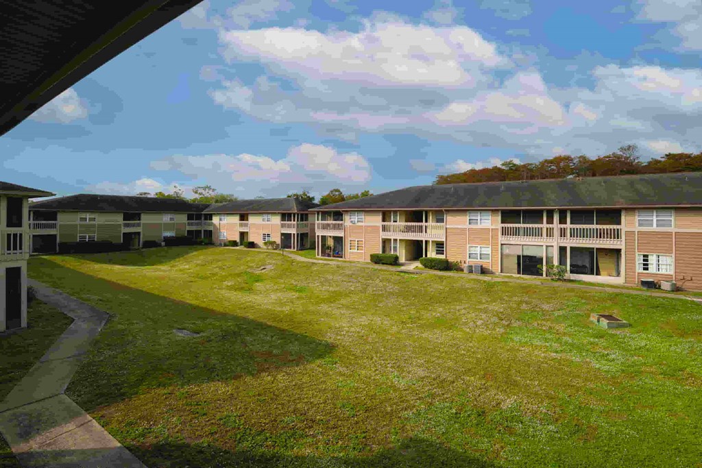 a view of an apartment complex from a window of a building